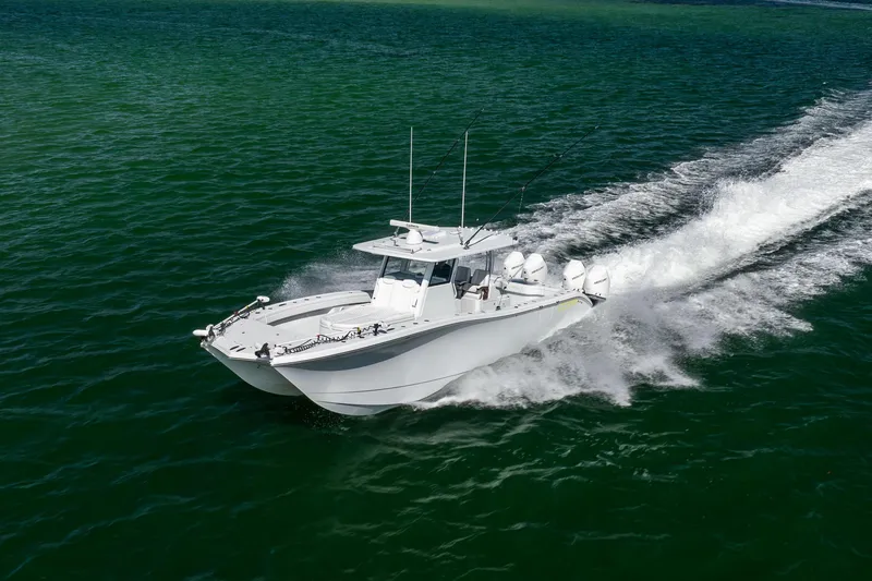  Yacht Photos Pics 2024 Costa Custom Boats 34 SV cruising on open water, showcasing sleek design and performance.