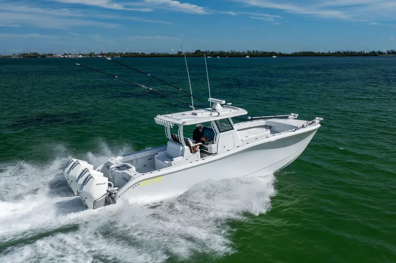  Yacht Photos Pics 2024 Costa Custom Boats 34 SV cruising on open water, showcasing sleek design and powerful engines.