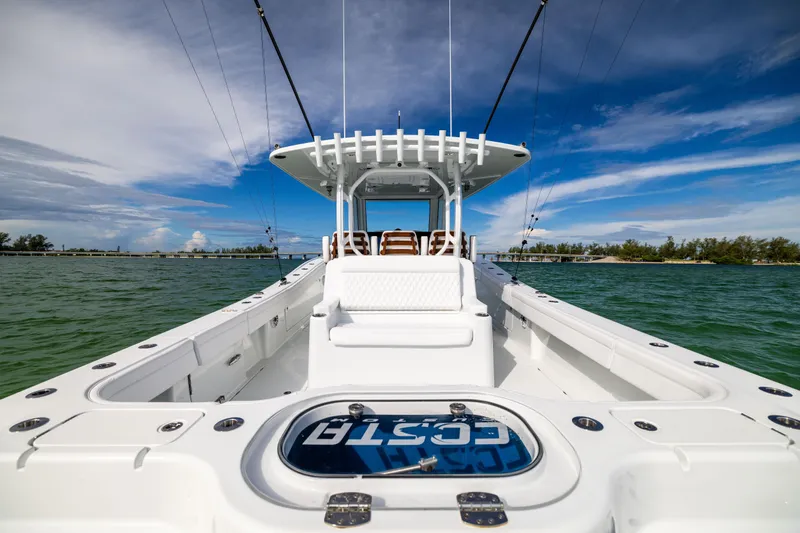  Yacht Photos Pics 2024 Costa Custom Boats 34 SV on water, showcasing sleek design and spacious deck.