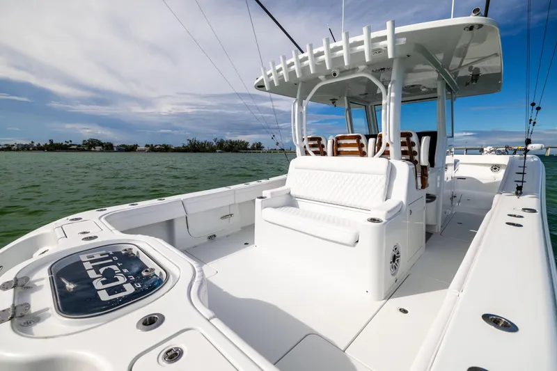  Yacht Photos Pics 2024 Costa Custom Boats 34 SV, sleek white design, spacious deck, luxury seating, ocean backdrop.