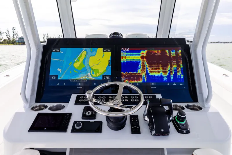  Yacht Photos Pics 2024 Costa Custom Boats 34 SV helm with advanced navigation displays and controls.