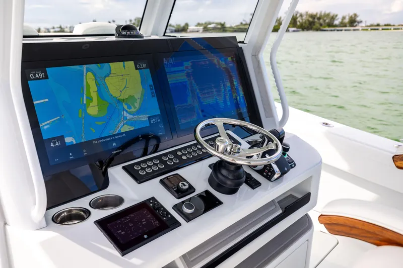  Yacht Photos Pics 2024 Costa Custom Boats 34 SV helm with advanced navigation displays and controls.