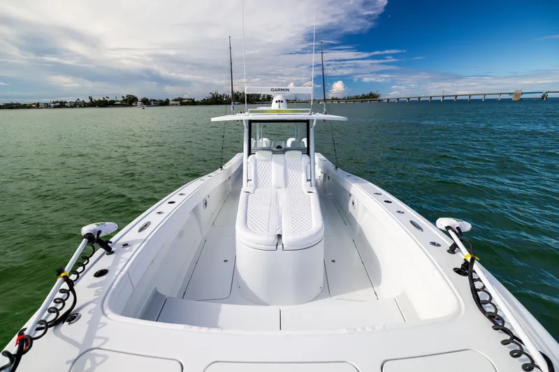  Yacht Photos Pics 2024 Costa Custom Boats 34 SV on calm waters, showcasing sleek design and spacious deck.