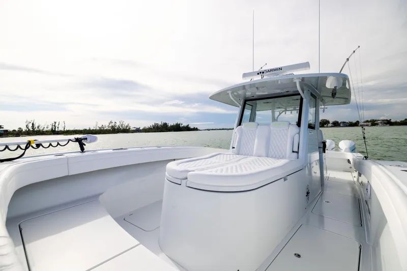  Yacht Photos Pics 2024 Costa Custom Boats 34 SV on calm water, showcasing sleek design and spacious deck.