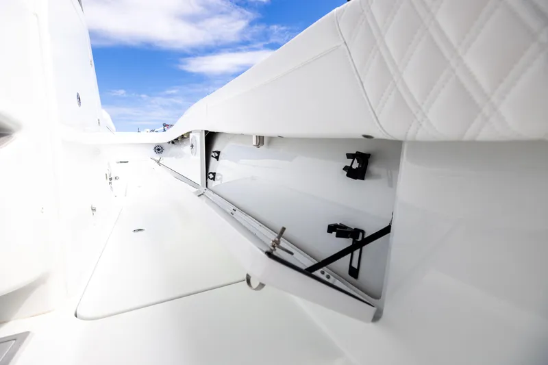  Yacht Photos Pics 2024 Costa Custom Boats 34 SV interior storage compartment with sleek white design.