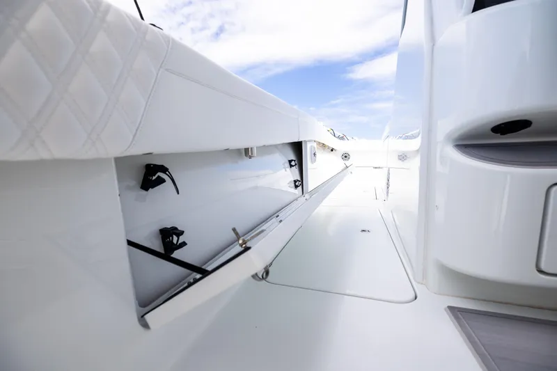 Yacht Photos Pics 2024 Costa Custom Boats 34 SV interior storage compartment, sleek white design, open hatch.