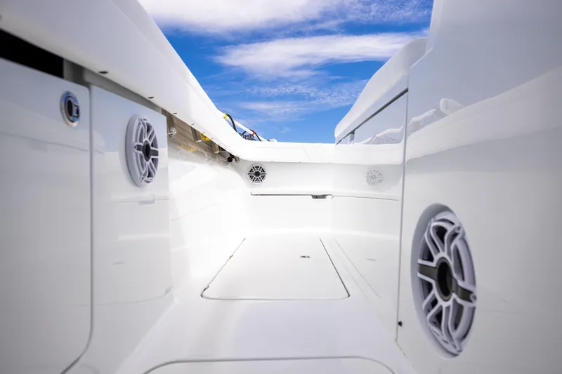  Yacht Photos Pics 2024 Costa Custom Boats 34 SV interior with speakers, sleek white design, and blue sky background.