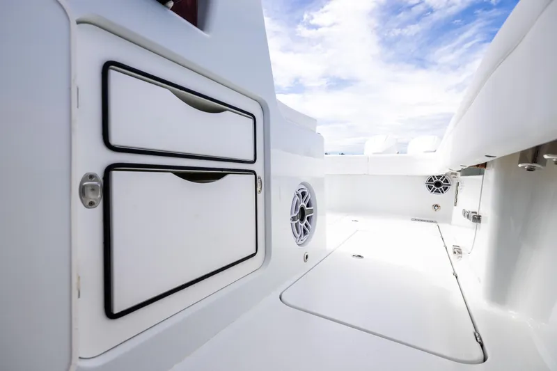  Yacht Photos Pics 2024 Costa Custom Boats 34 SV interior with storage compartments and speakers.