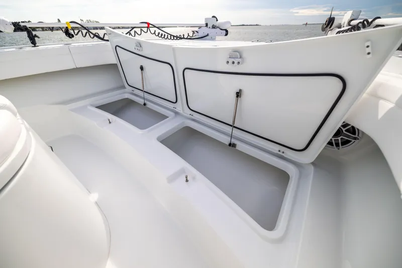  Yacht Photos Pics 2024 Costa Custom Boats 34 SV storage compartments open on deck, showcasing spacious design.