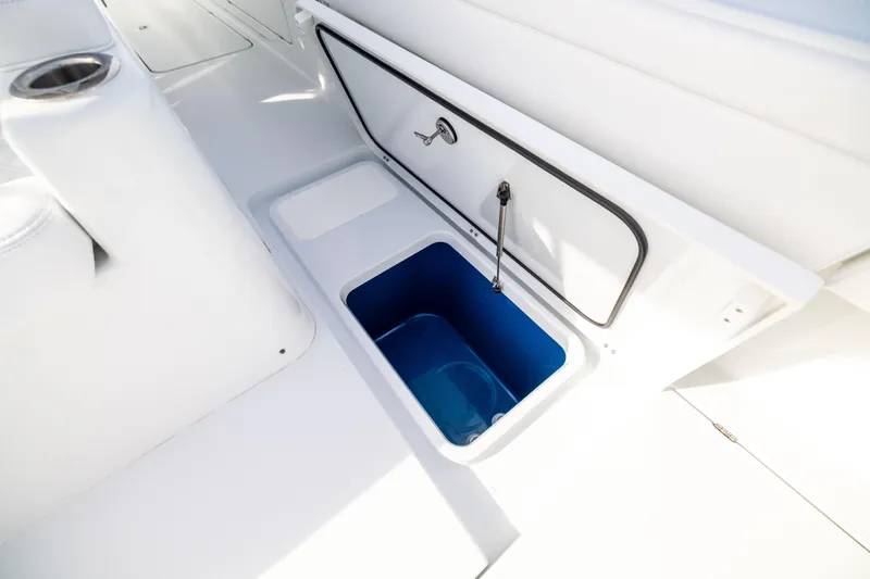  Yacht Photos Pics 2024 Costa Custom Boats 34 SV storage compartment with open hatch and blue interior.