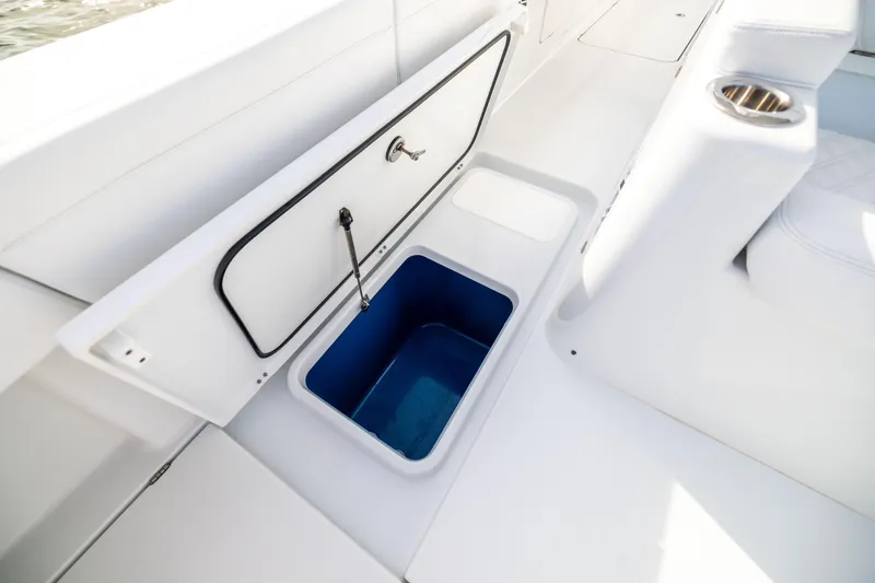  Yacht Photos Pics 2024 Costa Custom Boats 34 SV, open storage compartment with blue interior, white seating.