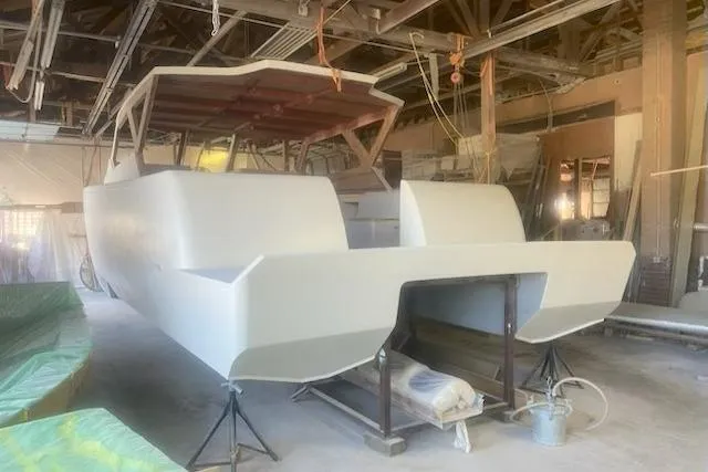  Yacht Photos Pics 2027 Compmillenia Lightspeed Tender under construction in a workshop setting.