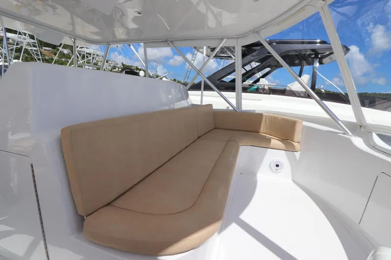 Breakaway Yacht Photos Pics Luxurious seating area on a 2004 Viking 56 yacht, featuring beige cushions and sleek design.