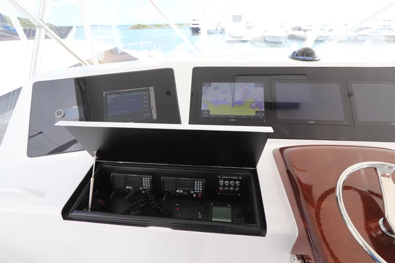 Breakaway Yacht Photos Pics 2004 Viking 56 yacht dashboard with navigation screens and communication equipment.