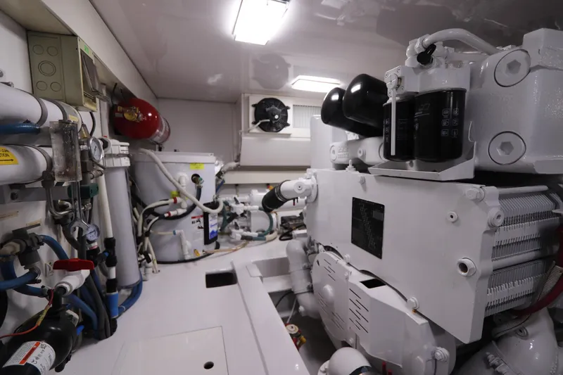 Breakaway Yacht Photos Pics Engine room of a 2004 Viking 56 yacht, featuring machinery and piping systems.