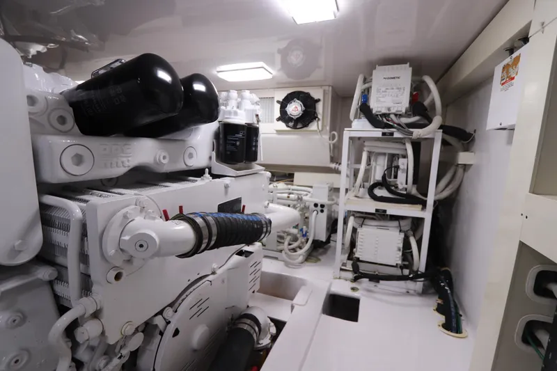 Breakaway Yacht Photos Pics Engine room of a 2004 Viking 56 yacht, showcasing mechanical components and equipment.