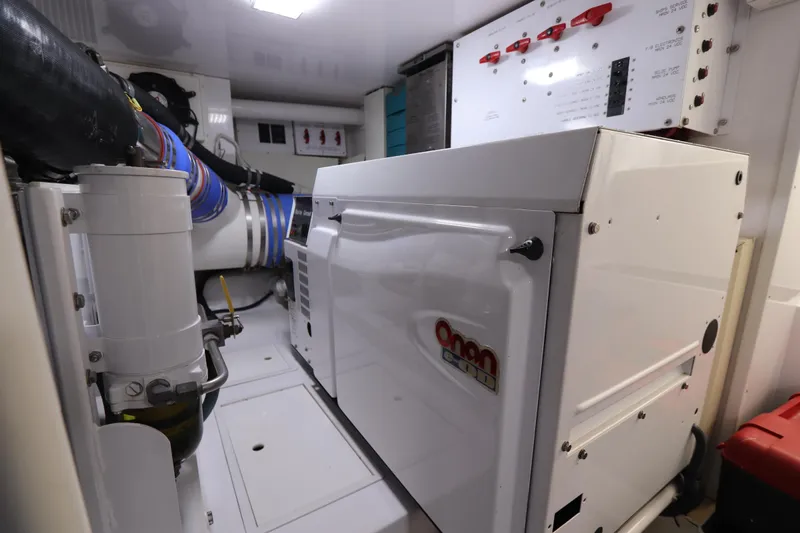 Breakaway Yacht Photos Pics Engine room of 2004 Viking 56 yacht with generator and control panels.