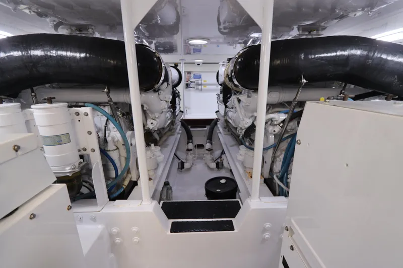 Breakaway Yacht Photos Pics Engine room of a 2004 Viking 56 yacht, featuring dual engines and clean layout.