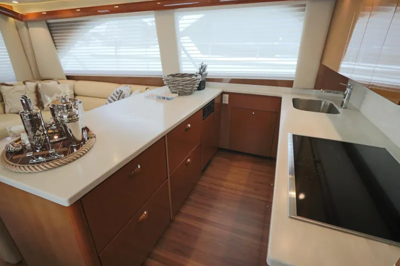 Breakaway Yacht Photos Pics Luxurious kitchen interior of a 2004 Viking 56 yacht with modern appliances and elegant decor.