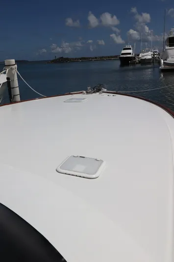 Breakaway Yacht Photos Pics 2004 Viking 56 yacht docked at marina with clear sky and calm water.