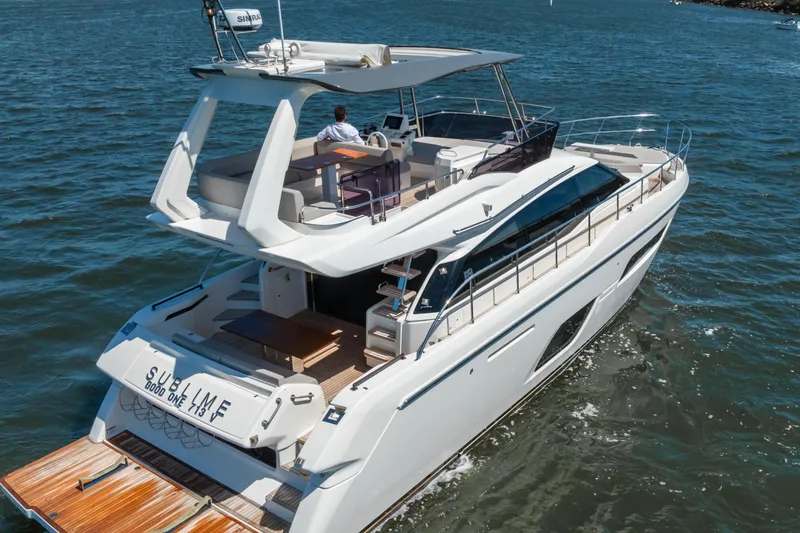 Sublime Yacht Photos Pics 2021 Ferretti Yachts 550 cruising on open water, showcasing sleek design and luxury features.