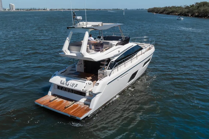 Sublime Yacht Photos Pics 2021 Ferretti Yachts 550 cruising on a sunny day, showcasing sleek design and luxury.