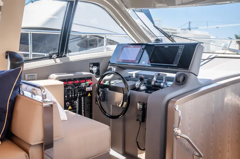 Sublime Yacht Photos Pics Luxurious 2021 Ferretti Yachts 550 helm with modern navigation systems and plush seating.