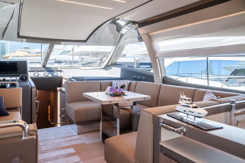 Sublime Yacht Photos Pics Luxurious interior of 2021 Ferretti Yachts 550 with elegant seating and modern design.