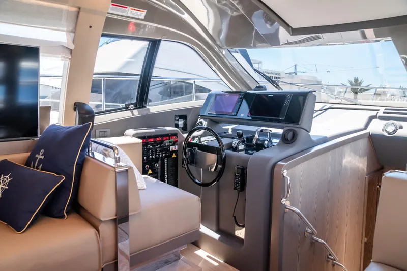 Sublime Yacht Photos Pics Luxurious 2021 Ferretti Yachts 550 interior with modern helm and plush seating.