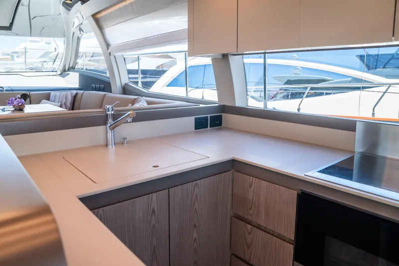 Sublime Yacht Photos Pics Modern kitchen interior of 2021 Ferretti Yachts 550 with sleek design and ample natural light.