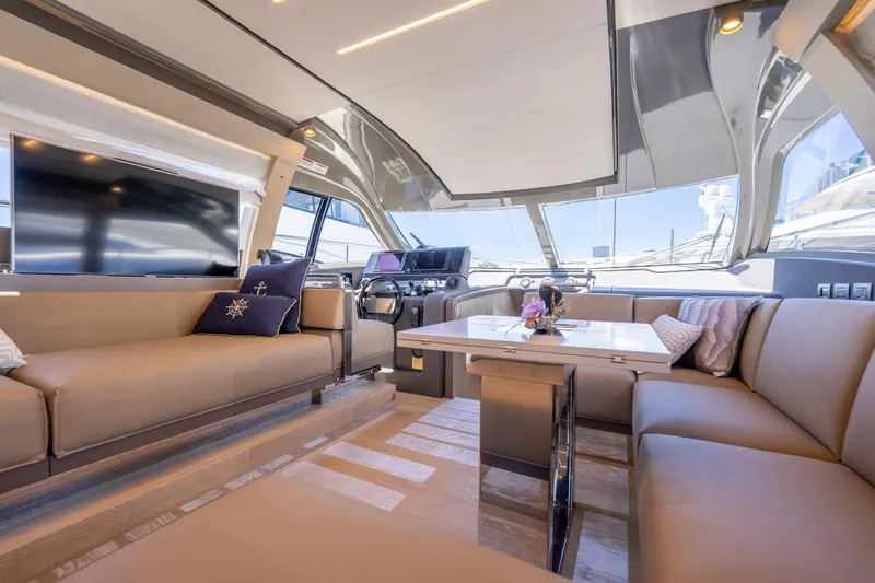 Sublime Yacht Photos Pics Luxurious interior of 2021 Ferretti Yachts 550 with elegant seating and modern design.