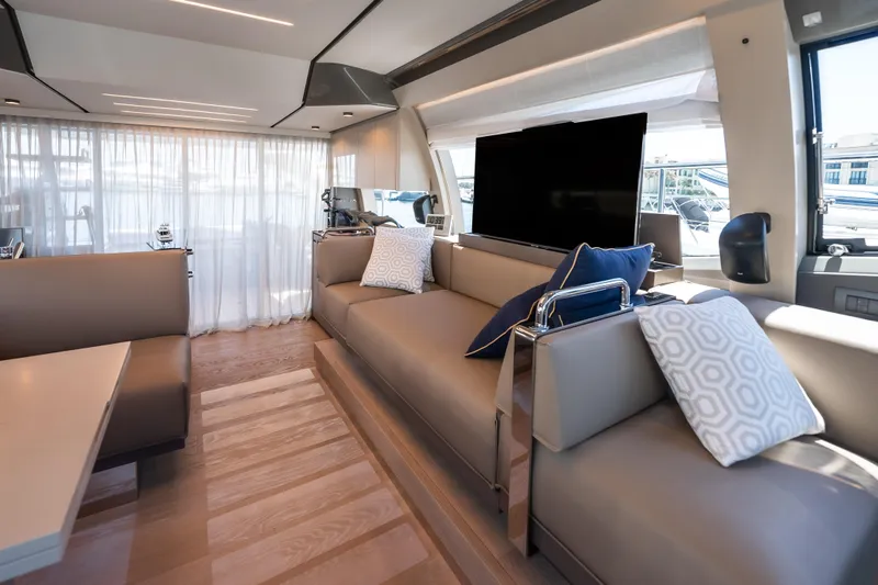 Sublime Yacht Photos Pics Luxurious interior of 2021 Ferretti Yachts 550 with modern seating and elegant decor.