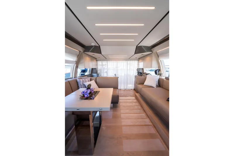 Sublime Yacht Photos Pics Luxurious interior of 2021 Ferretti Yachts 550, featuring elegant seating and modern design.
