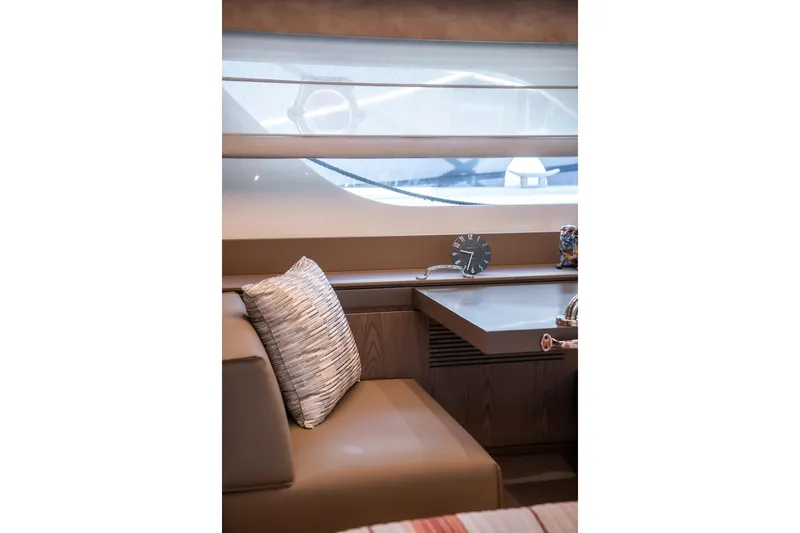 Sublime Yacht Photos Pics Interior of 2021 Ferretti Yachts 550, featuring a cozy seating area with a pillow.