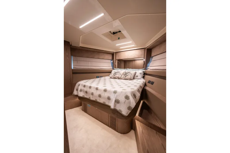 Sublime Yacht Photos Pics Luxurious bedroom interior of 2021 Ferretti Yachts 550, featuring elegant bedding and modern design.