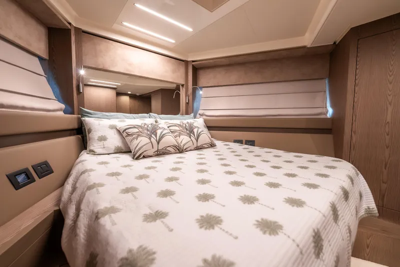 Sublime Yacht Photos Pics Luxurious bedroom interior of 2021 Ferretti Yachts 550 with elegant bedding and modern design.