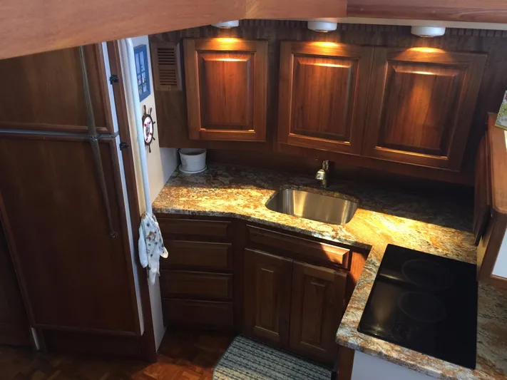  Yacht Photos Pics 1989 Viking 41 Sportfish Convertible kitchen with wooden cabinets.