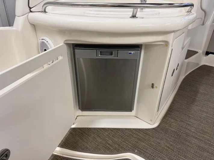  Yacht Photos Pics 2008 Sea Ray 340 Sundancer interior with built-in mini fridge and storage.