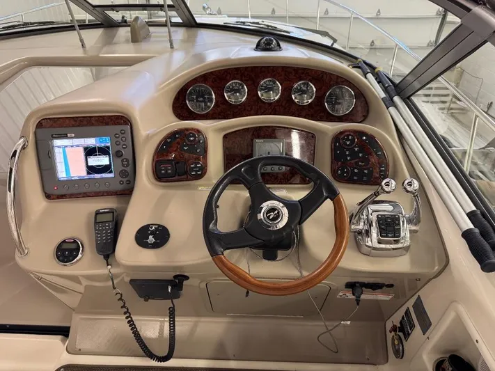  Yacht Photos Pics Control panel of 2008 Sea Ray 340 Sundancer boat with steering wheel and navigation instruments.