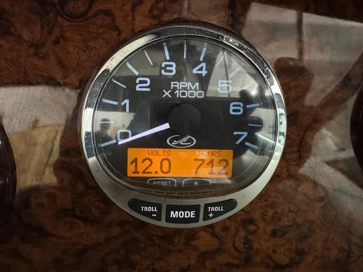  Yacht Photos Pics Close-up of a 2008 Sea Ray 340 Sundancer RPM gauge displaying 12.0 volts and 712 hours.