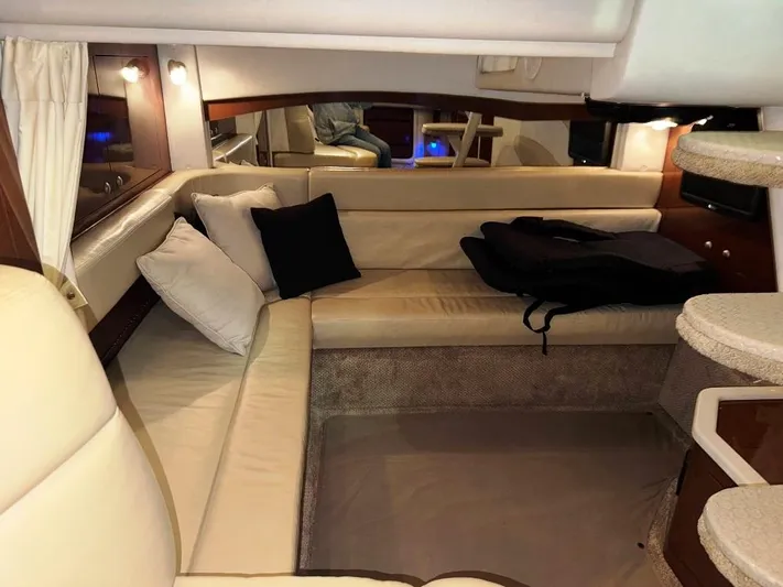  Yacht Photos Pics Interior of 2008 Sea Ray 340 Sundancer with beige seating and cushions.