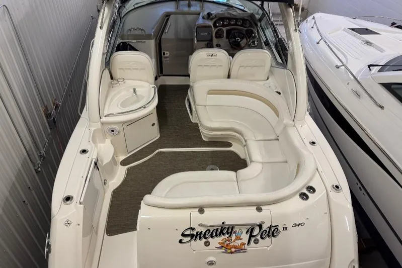  Yacht Photos Pics 2008 Sea Ray 340 Sundancer boat interior with seating and helm, docked indoors.