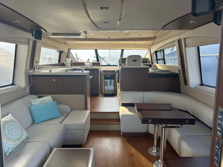  Yacht Photos Pics Luxurious interior of 2015 Sea Ray 510 Fly yacht with modern seating and elegant design.