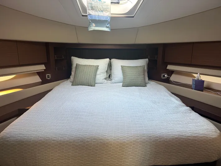  Yacht Photos Pics Luxurious bedroom interior of 2015 Sea Ray 510 Fly yacht with skylight and modern decor.