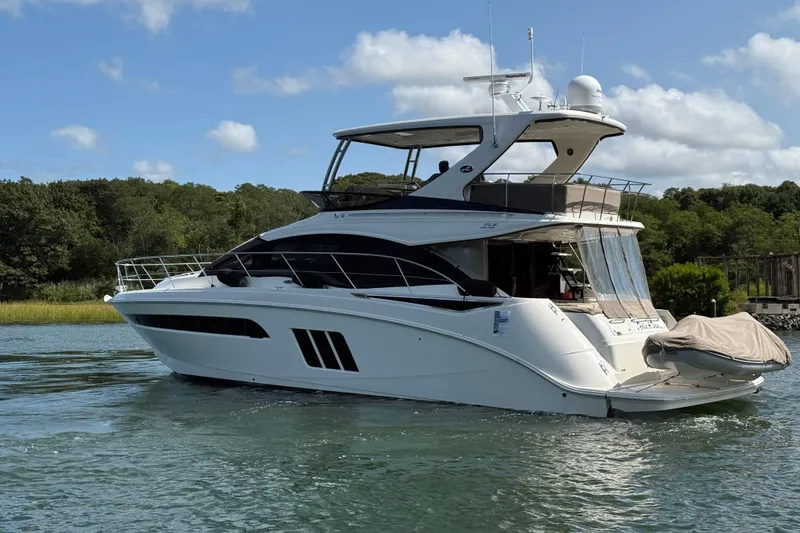  Yacht Photos Pics 2015 Sea Ray 510 Fly yacht cruising on a serene waterway.