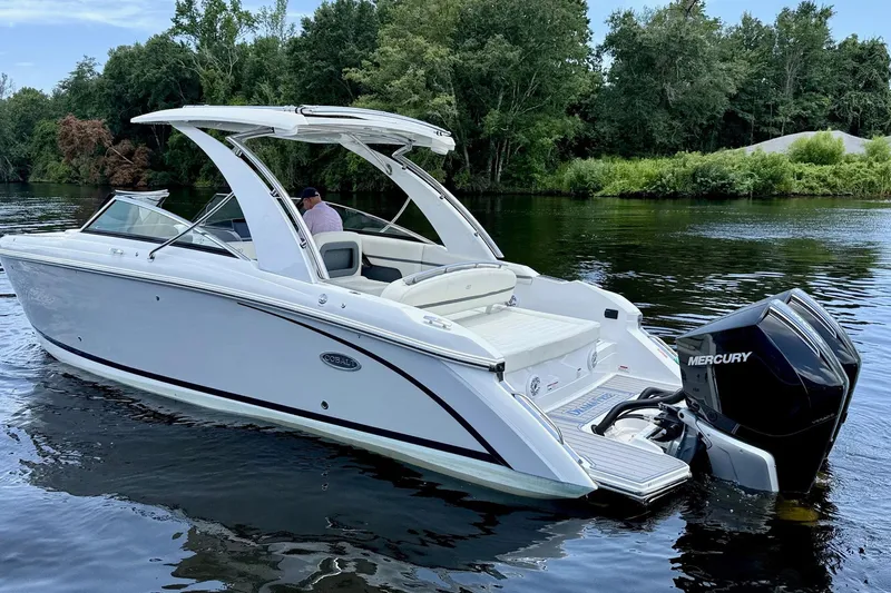 Drama Free Yacht Photos Pics 2022 Cobalt R30 boat with Mercury engine on a calm lake.