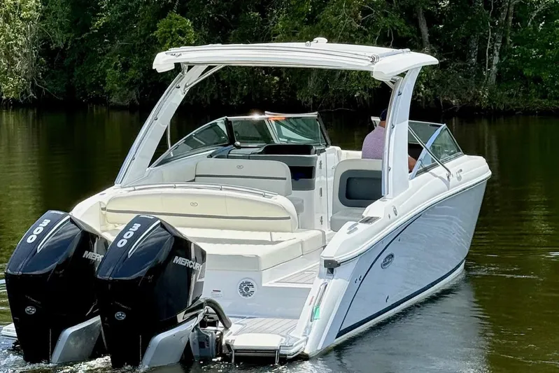 Drama Free Yacht Photos Pics 2022 Cobalt R30 boat with dual Mercury engines on a calm river.