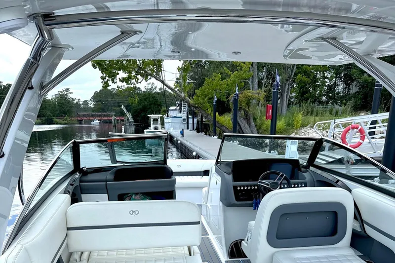 Drama Free Yacht Photos Pics 2022 Cobalt R30 boat interior at dock, featuring sleek design and modern controls.