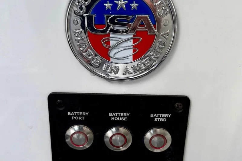 Drama Free Yacht Photos Pics Cobalt R30 2022 boat battery panel with "Made in America" emblem.