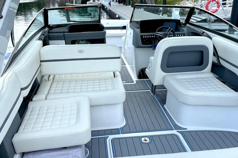 Drama Free Yacht Photos Pics 2022 Cobalt R30 boat interior with white seating and modern dashboard design.